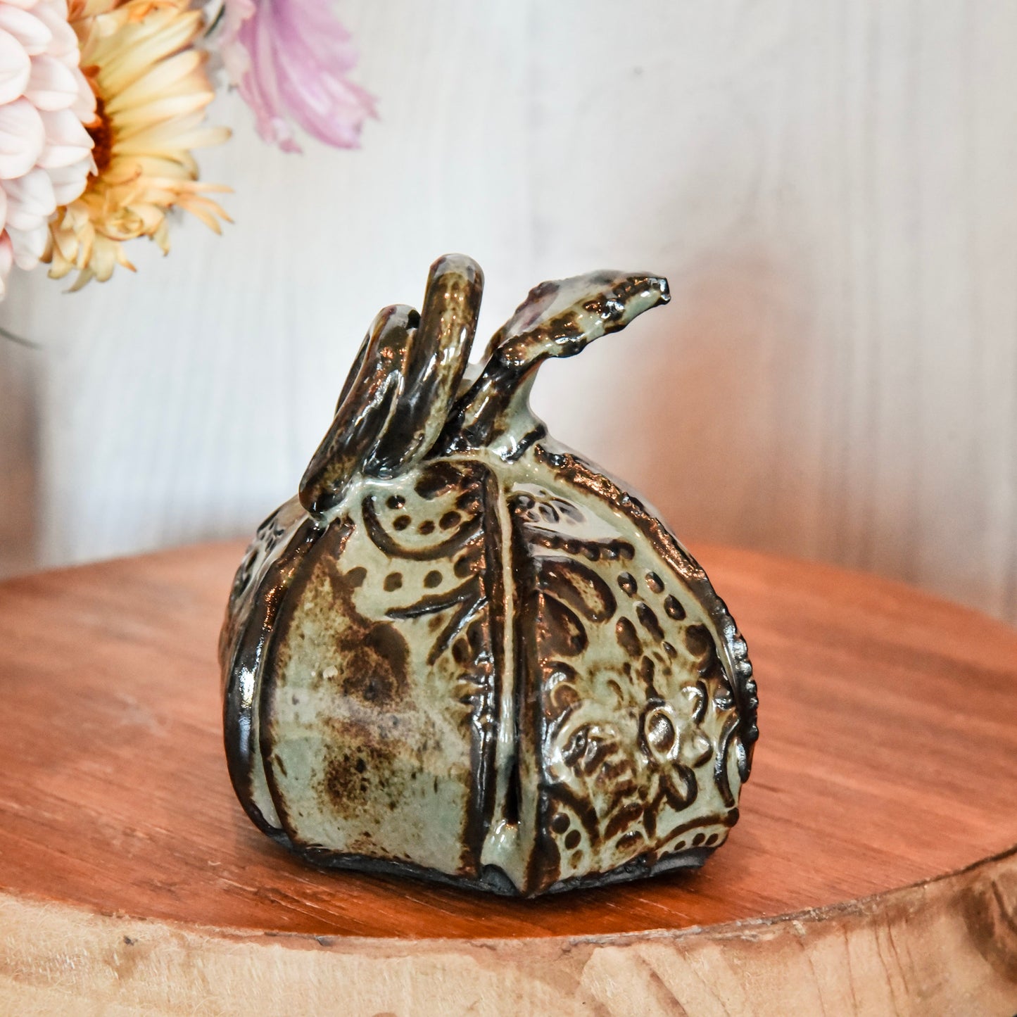 Small Pumpkin in Green on Chocolate Clay